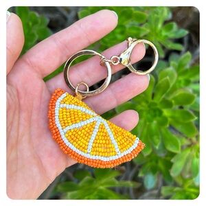 Anthropologie beaded orange bag charm